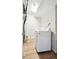 Functional laundry area features modern appliances and plenty of room for storage at 7680 Depew St # 1404, Arvada, CO 80003