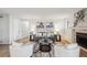 Bright and airy living room with a fireplace and stylish decor at 7680 Depew St # 1404, Arvada, CO 80003