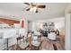 Spacious living space featuring a dining area, kitchen bar, and living room area at 7680 Depew St # 1404, Arvada, CO 80003