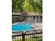 Community pool with a lifeguard ring and a covered area for residents to relax at 7680 Depew St # 1404, Arvada, CO 80003