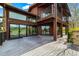 Beautiful home showcasing a large back deck and mountain views through sliding glass doors and large windows at 10895 Pheasant Run, Littleton, CO 80125