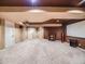 Open basement layout featuring a fireplace and media screen, perfect for entertaining at 10895 Pheasant Run, Littleton, CO 80125