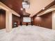 Basement with fireplace and media screen, offering a cozy entertainment space at 10895 Pheasant Run, Littleton, CO 80125