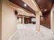 Finished basement area with cozy fireplace, dark accent walls, and neutral carpet at 10895 Pheasant Run, Littleton, CO 80125