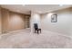 Carpeted bedroom featuring neutral paint, a ceiling light, and a window with natural light at 10895 Pheasant Run, Littleton, CO 80125