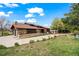 Charming single Gathering home with a beautiful stone and wood facade, mature landscaping and a spacious driveway at 10895 Pheasant Run, Littleton, CO 80125