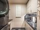 A laundry room features granite countertops and stainless steel appliances at 10895 Pheasant Run, Littleton, CO 80125