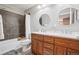 Bathroom features a double sink vanity with modern fixtures and a shower/tub combo at 1557 S Dallas Cir, Denver, CO 80247