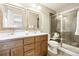 Elegant bathroom with double vanity, framed mirrors, and a glass-enclosed shower for a spa-like experience at 1557 S Dallas Cir, Denver, CO 80247