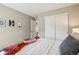 Serene bedroom with double closets and neutral paint at 1557 S Dallas Cir, Denver, CO 80247