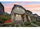 Charming two-story townhome featuring a stone-accented facade and well-maintained landscaping at 1557 S Dallas Cir, Denver, CO 80247
