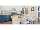 Modern kitchen with island, stainless steel appliances, and two-tone cabinetry at 1557 S Dallas Cir, Denver, CO 80247