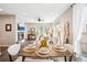 Stylish living area with cozy seating, contemporary fireplace, and an adjacent dining space at 1557 S Dallas Cir, Denver, CO 80247