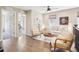 Bright and airy living room featuring hardwood floors and neutral furniture at 1557 S Dallas Cir, Denver, CO 80247