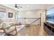 Upstairs loft area boasts hardwood floors, neutral paint and modern furniture at 1557 S Dallas Cir, Denver, CO 80247
