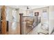 Relaxing landing space on the second story with hardwood floors and natural light at 1557 S Dallas Cir, Denver, CO 80247
