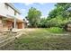 A large backyard with some corn, and brick house, and lots of room for activities at 1341 S Blackhawk Way, Aurora, CO 80012