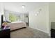 Inviting bedroom featuring neutral carpeting, a cozy bed, and ample closet space at 1341 S Blackhawk Way, Aurora, CO 80012