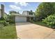 Inviting two-story home with a spacious driveway, attached garage, and a lush green lawn at 1341 S Blackhawk Way, Aurora, CO 80012