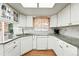 Well-lit kitchen with white cabinetry, granite counters, and modern fixtures at 1341 S Blackhawk Way, Aurora, CO 80012