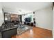 Inviting living room with hardwood floors, brick fireplace, and a large window at 1341 S Blackhawk Way, Aurora, CO 80012