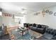 Spacious living room with hardwood floors and a partial view of the kitchen at 1341 S Blackhawk Way, Aurora, CO 80012