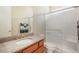 Bathroom featuring a walk-in shower and granite countertop sink at 10003 Atlanta St, Parker, CO 80134