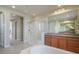 Bright bathroom featuring a modern glass-enclosed shower, and double vanity sinks at 10003 Atlanta St, Parker, CO 80134