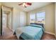 Well-lit bedroom with a comfortable bed, a large window, and neutral décor at 10003 Atlanta St, Parker, CO 80134