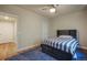 Comfortable bedroom with a ceiling fan, ample light and a stylish bed and a blue rug at 10003 Atlanta St, Parker, CO 80134