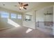 Bright bonus room with multiple windows providing ample natural light and adjacent staircase at 10003 Atlanta St, Parker, CO 80134