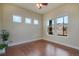 Bright and airy room with hardwood floors, large windows, and neutral decor at 10003 Atlanta St, Parker, CO 80134