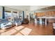 Open living space with views from large windows joining the kitchen in this open floorplan at 10003 Atlanta St, Parker, CO 80134