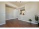 Open concept living space featuring hardwood floors, neutral color palette, and plenty of natural light at 10003 Atlanta St, Parker, CO 80134