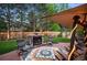 Landscaped backyard with fire pit and seating at 7956 S Eudora Cir, Centennial, CO 80122