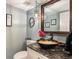 Powder room with a vessel sink and granite countertop at 7956 S Eudora Cir, Centennial, CO 80122