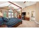 Main bedroom with a king-size bed, fireplace, and en-suite bathroom at 7956 S Eudora Cir, Centennial, CO 80122