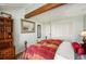 Bedroom with a double bed and built-in wooden shelving at 7956 S Eudora Cir, Centennial, CO 80122