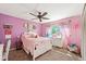 bedroom with a white bed frame and pink accents at 7956 S Eudora Cir, Centennial, CO 80122