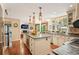 Spacious kitchen with large island and granite countertops at 7956 S Eudora Cir, Centennial, CO 80122