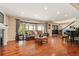 Living room with hardwood floors, large windows, and fireplace at 7956 S Eudora Cir, Centennial, CO 80122