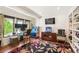 Home office with built-in shelving and large windows at 7956 S Eudora Cir, Centennial, CO 80122