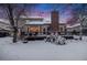 This large home has a big backyard, deck, and tall chimney at 11418 W Roxbury Ave, Littleton, CO 80127