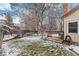 A big backyard with a deck and bench at 11418 W Roxbury Ave, Littleton, CO 80127