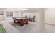 Basement game room featuring a pool table, seating and plenty of storage at 11418 W Roxbury Ave, Littleton, CO 80127
