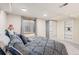 Finished basement bedroom featuring a large closet, a large window, and a bed at 11418 W Roxbury Ave, Littleton, CO 80127