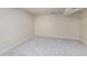 A basement with carpeted floors and drywall at 11418 W Roxbury Ave, Littleton, CO 80127