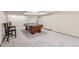 Finished basement space featuring a pool table, seating, and neutral colored carpet at 11418 W Roxbury Ave, Littleton, CO 80127