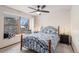 Cozy bedroom with a decorative bed, plush pillows, and a sunny window seat at 11418 W Roxbury Ave, Littleton, CO 80127