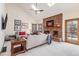 Bright living room with a brick fireplace, vaulted ceiling with skylights, and comfortable seating area, perfect for relaxation at 11418 W Roxbury Ave, Littleton, CO 80127